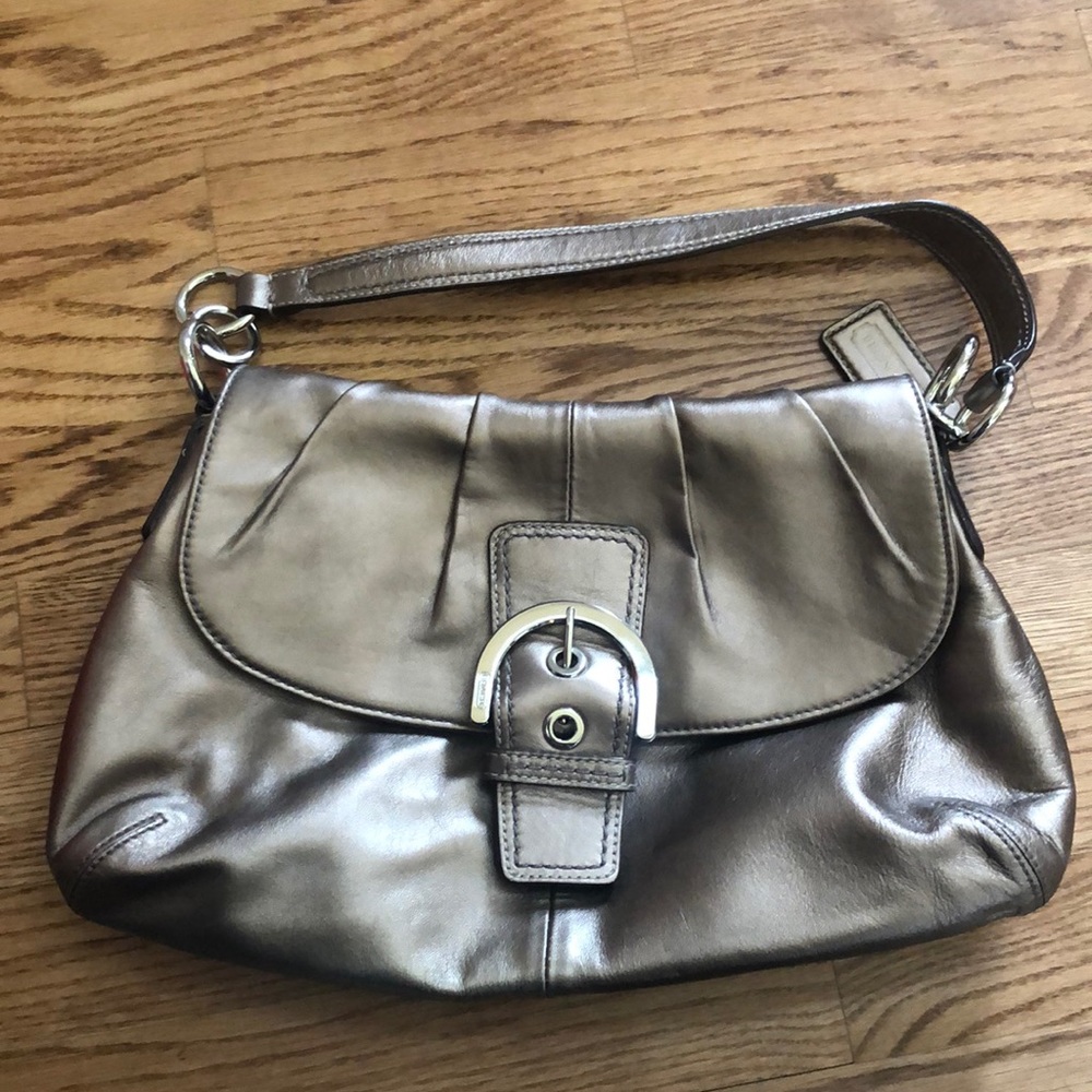 Coach purse with belt buckle clasp